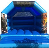 a blue Starwars themed Bouncy Castle